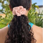 Woman wearing a 22 Momme Mulberry Silk Scrunchie Smoky Rose by Sigma Silk