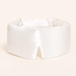 Pearl-white-filled-sleep-mask-on-model.jpg