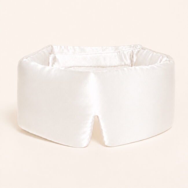 Pearl-white-filled-sleep-mask-on-model.jpg