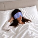 periwinkle blue--silk-filled-sleep-mask-on-model.jpg