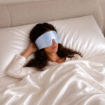 sky-blue-silk-filled-sleep-mask-on-model.jpg