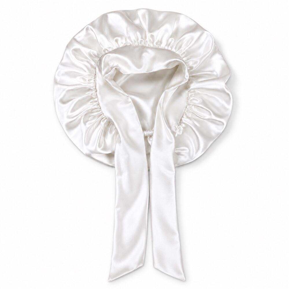 Pearl White silk bonnet with full ribbon ties on a white background