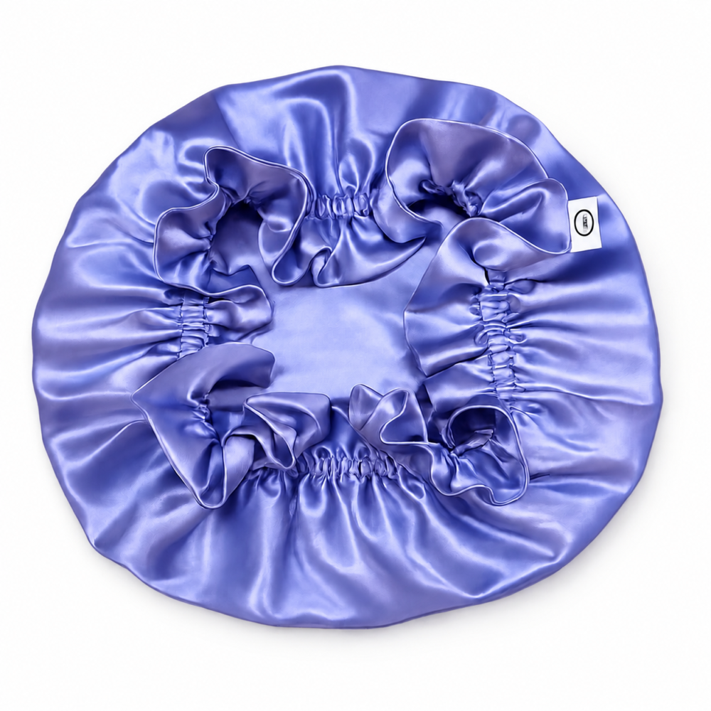 Periwinkle blue silk bonnet on a white background